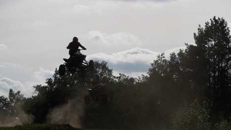 Quad-race-Quad-jumps-over-hill-camera-follows-in-Berlin-Germany