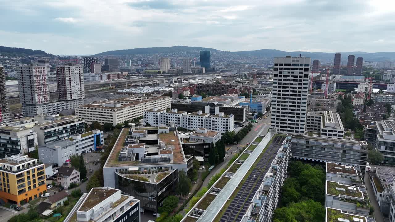 Solar panels on roof of modern apartment complex in downtown of Zurich City