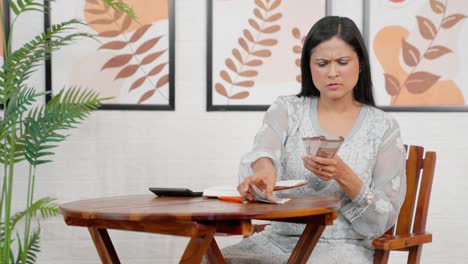 Middle-age-woman-calculating-money