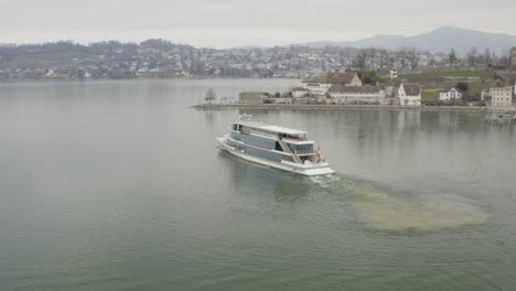 orbit around a ferry in the port of rapperswil with the famous castle