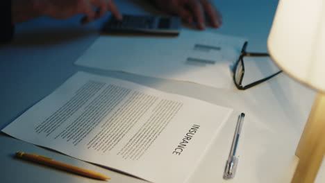 man filling out insurance papers