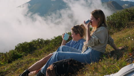 two women enjoying a mountaintop break