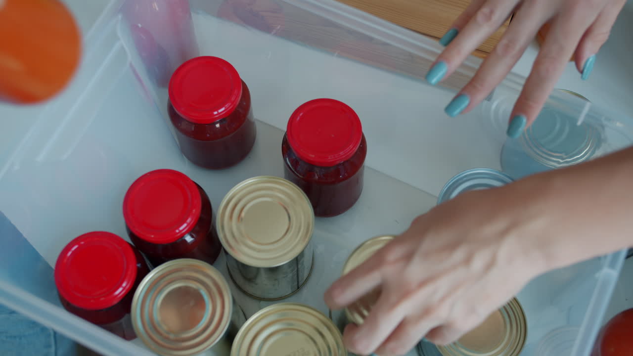 Organizing Canned Goods and Jars in a Plastic Container