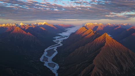 sunrise over a mountain valley with a winding river