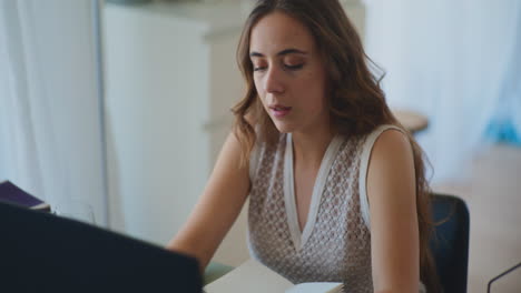 pensive woman working on laptop