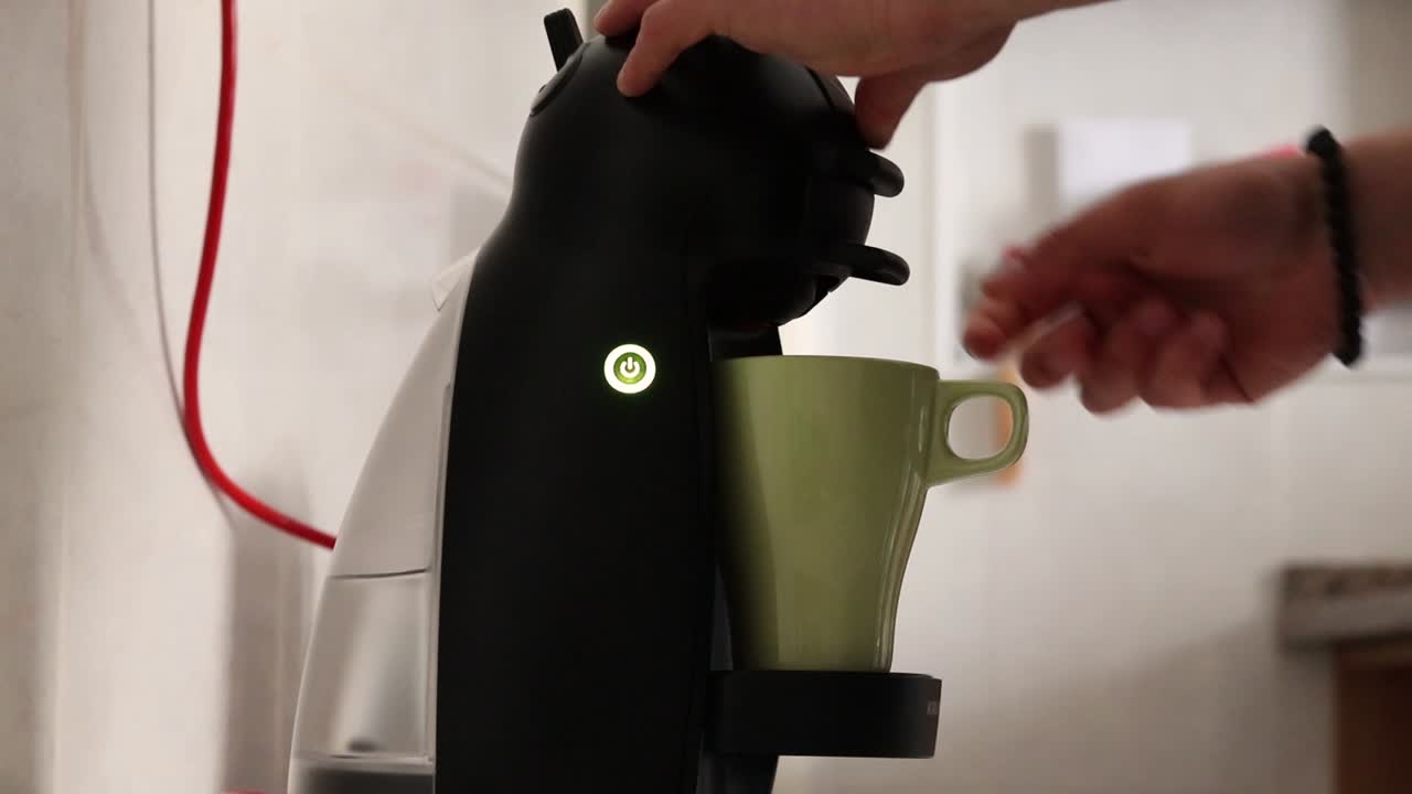Man making coffee with a coffee machine, part one