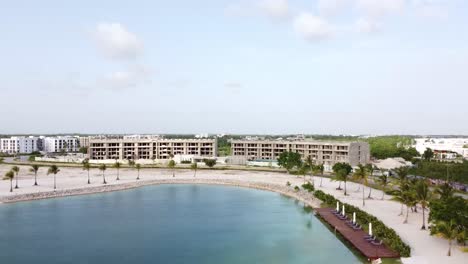 dominican republic, punta cana - 2023 - panoramic drone view of an urban vacation resort with beautiful artificial lake