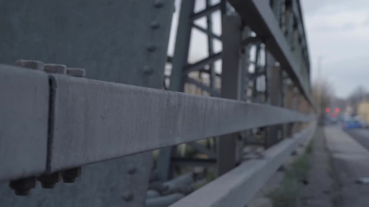 Metal bridge on highway with railings and metal supports