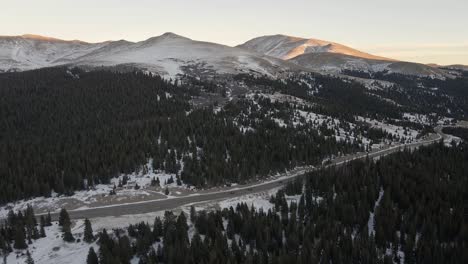 Aerial-footage-flying-over-highway-9-towards-Hoosier-Ridge-in-December-with-snow-on-the-ground