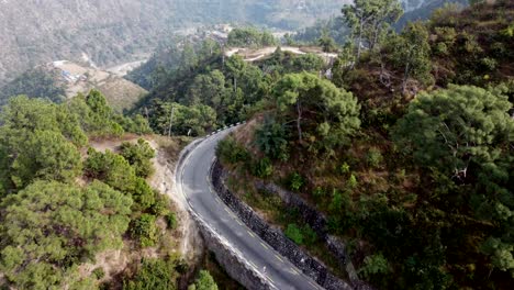 drone footage of a turning mountain road in the hills of nepal