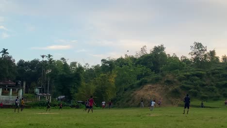 Men-playing-football-on-the-field