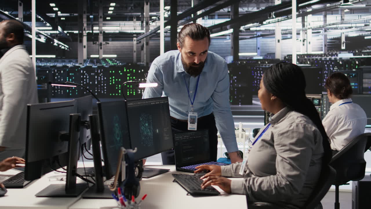 Vertical video Server room manager providing feedback to employee managing AI datasets