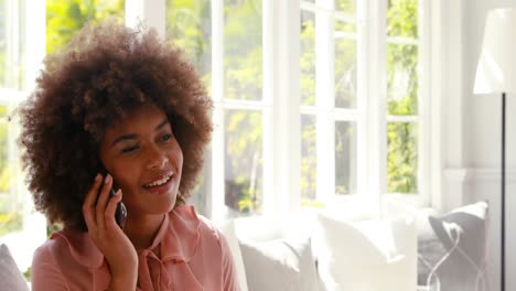 Happy-woman-talking-on-mobile-phone