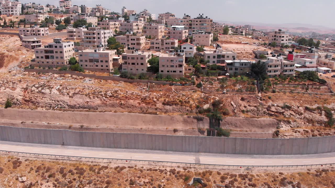 Aerial view over qalandiya refugee camp and the security wall
