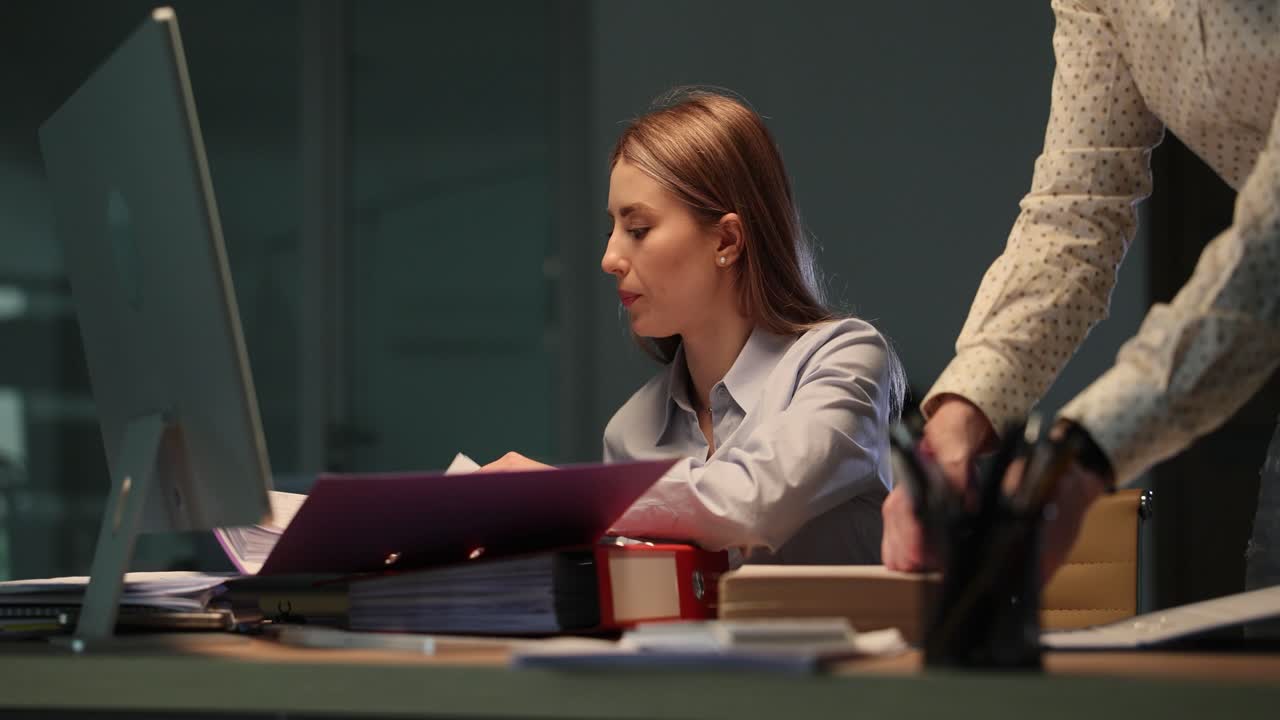Colleagues working late in an office