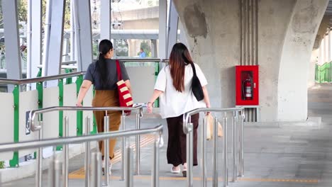 two people meet and chat at a station