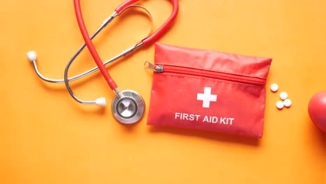 first aid kit with stethoscope and medical supplies