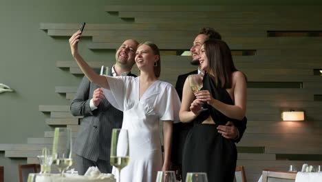 Two-couples-posing-for-photo-in-restaurant