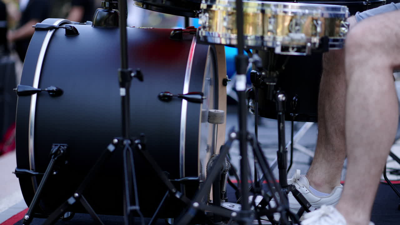 Close up of man playing the drums outside