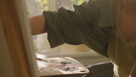 woman painting in an art studio