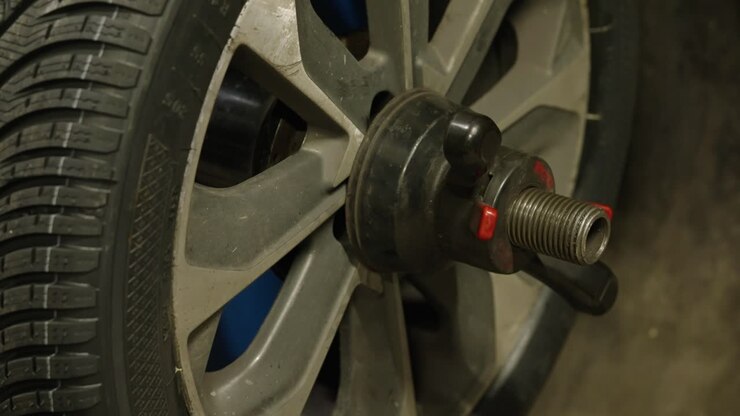 Close-up of wheel in motion with the unscrewing tool
