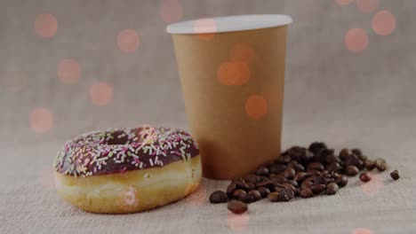 Animación-De-Café-Y-Donut-Sobre-Puntos-De-Luz.