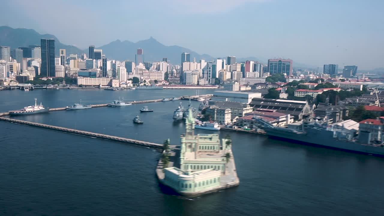 Flight arrival in the city of Rio de Janeiro at the city airport right in the centre, with visibly some of the landmarks of the city such as the Museum of Tomorrow and Fiscal Island