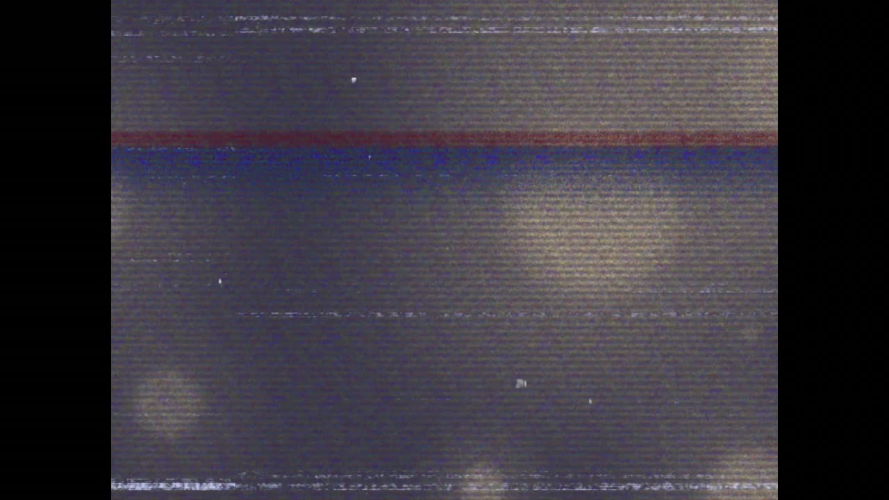 Animation of glitch interference over glowing spots on black background