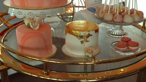 delicious tasty wedding sweets and cake on glass table, motion shot