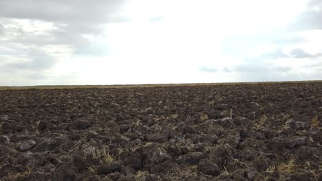 just plowed field and cloudy sky