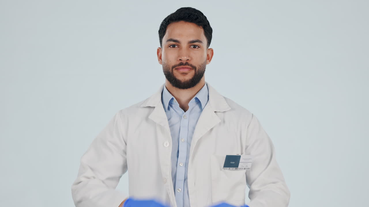 Thumbs up, medical doctor or a man in studio