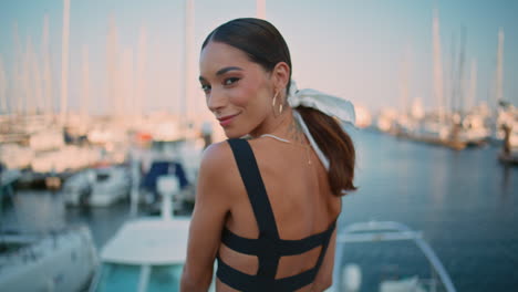 woman enjoying the view from a marina