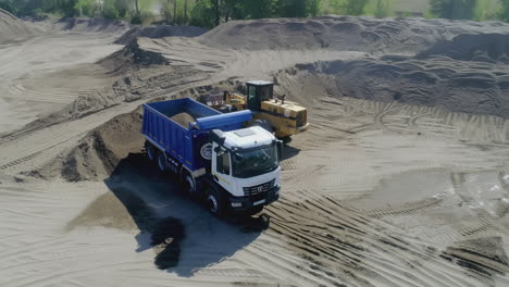 dump truck and bulldozer at construction site