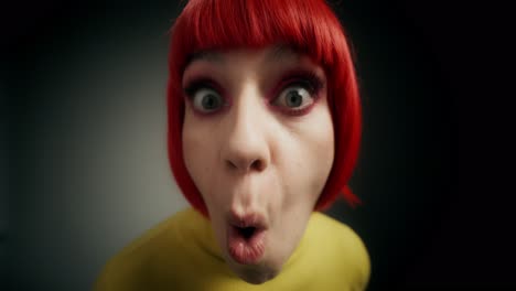 woman with red hair and yellow sweater