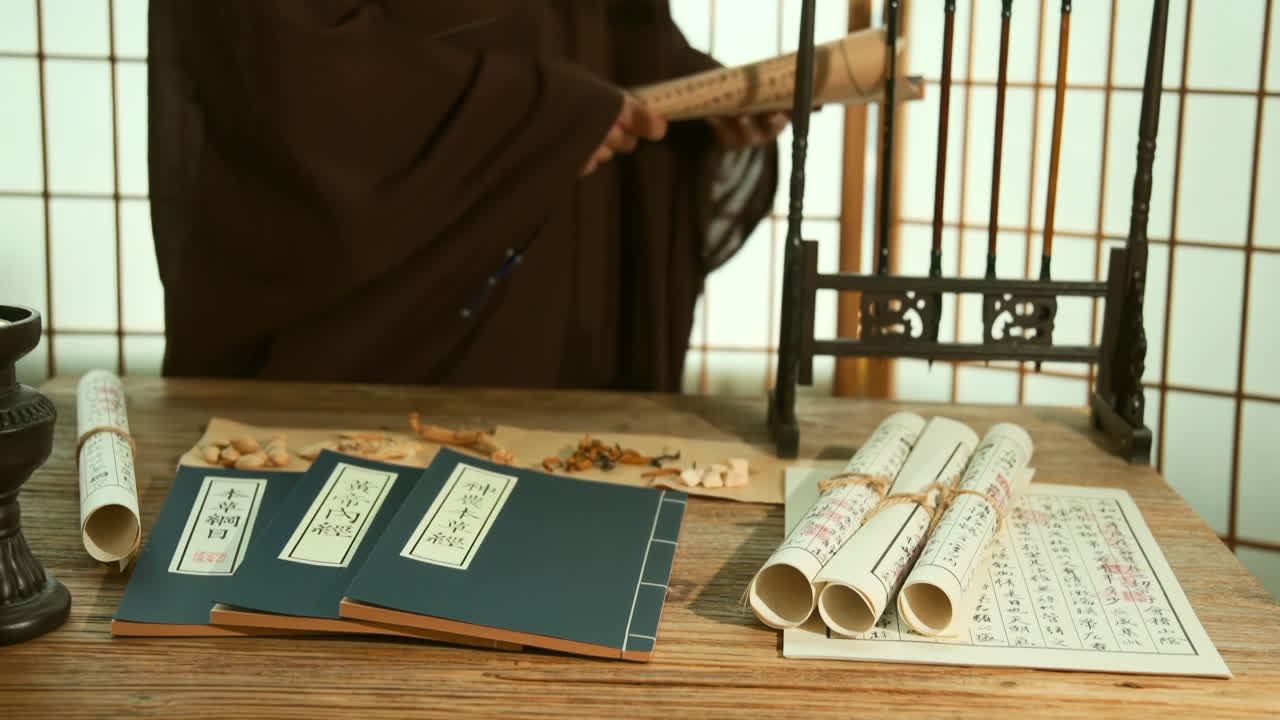 Chinese medicinal materials while consulting ancient medical books, Actual footage for an advertisement with the theme of traditional medicine, physician