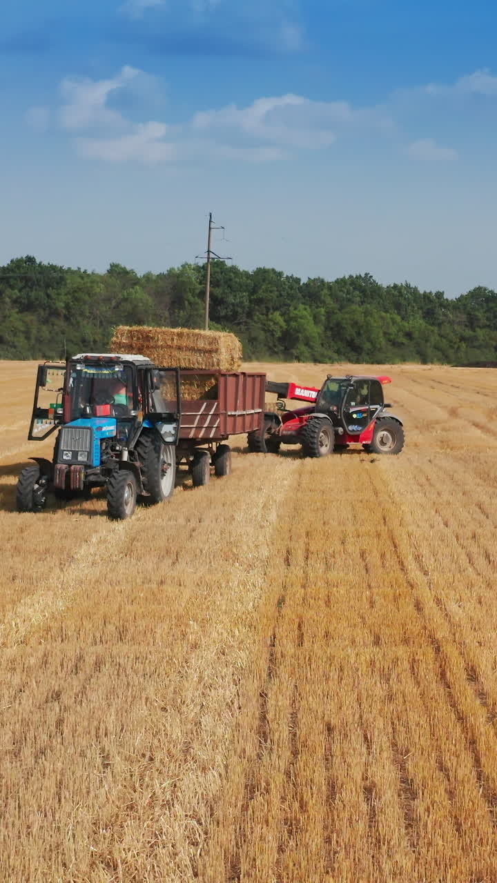 Machinery agricultural farming equipment. Landscape countryside harvesting. Vertical video