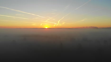 sunrise drone flight on a foggy day