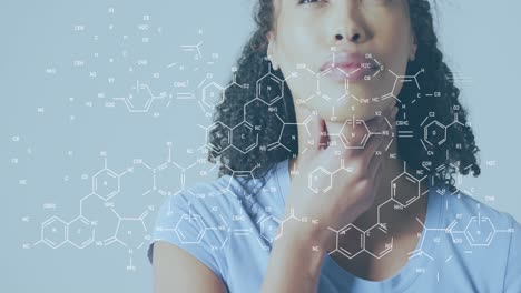 animation of chemical structures over biracial woman thinking