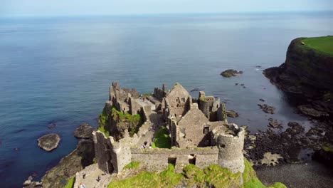 Aerial-shot-of-Dunluce-Castle,-in-Bushmills-on-the-North-County-Antrim-coast-in-Northern-Ireland