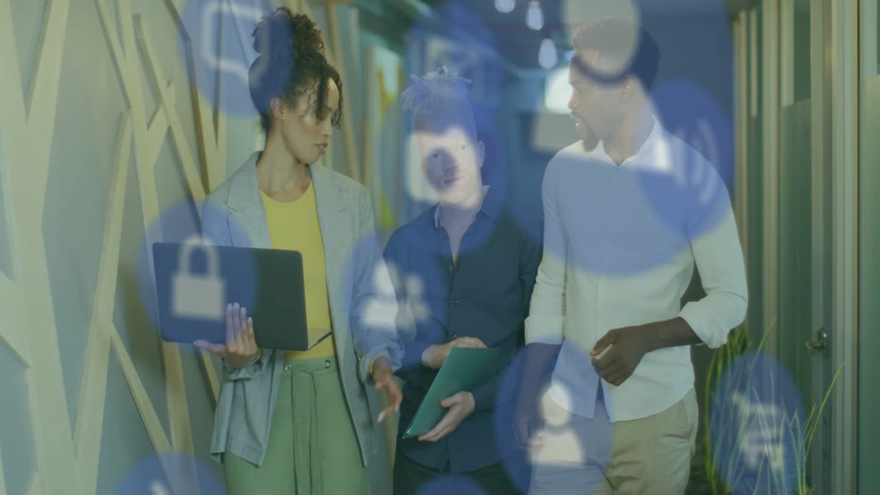 Three walking hall left woman using laptop initiating security check, blue icons overlaying devices