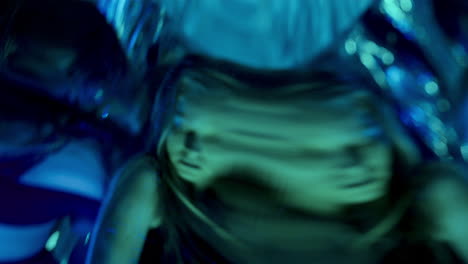 amazed female dancer looking in at surreal distorted reflections