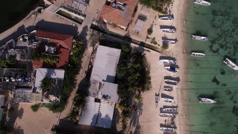 aerial-view-airport-Caribbean-island,-travel-destination,-zenith-shot-movement-back