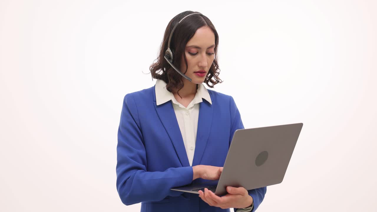 Professional Businesswoman in Headset Using Laptop