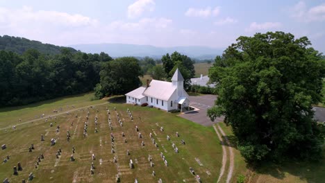 aerial slow push into church chapel near abingdon virginia not from from damascus virginia in peacefull setting nestled in a mountain valley