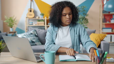 teenage girl studying at home