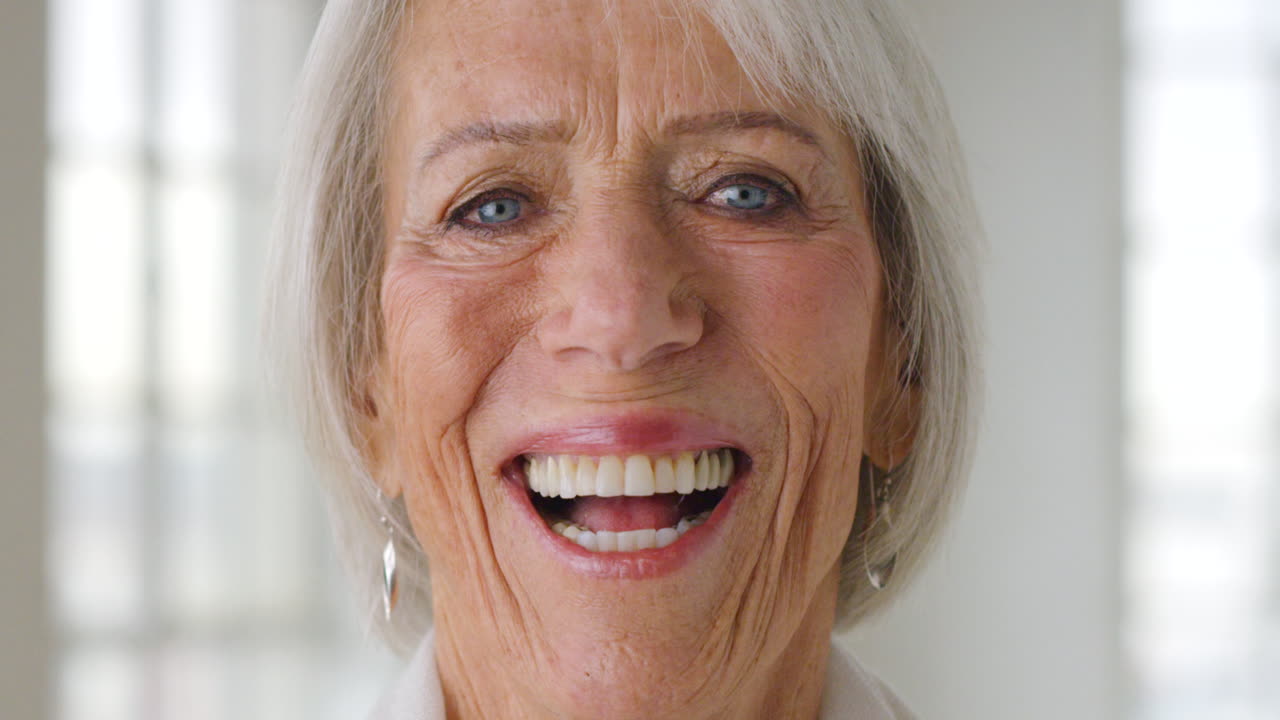 Closeup of cheerful mature woman laughing