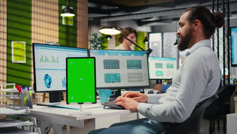 vertical video male executive manager works with graphs and isolated mockup screen