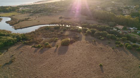 Aerial-view-of-the-Rio-De-La-Jara-river-feeding-into-the-ocean-on-Spain's-coast