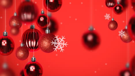 animación de la nieve cayendo sobre las decoraciones de las joyas de navidad sobre fondo rojo