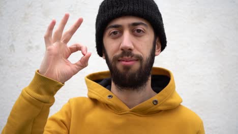 white man showing an ok hand gesture. close-up